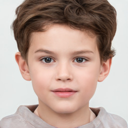 Joyful white child male with short  brown hair and brown eyes