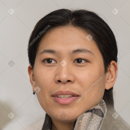 Joyful asian adult female with medium  brown hair and brown eyes