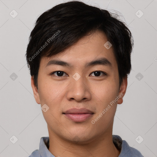 Joyful asian young-adult male with short  black hair and brown eyes