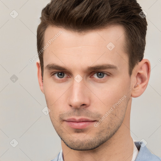 Neutral white young-adult male with short  brown hair and brown eyes