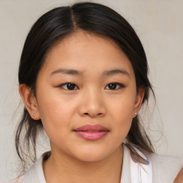 Joyful asian young-adult female with medium  brown hair and brown eyes