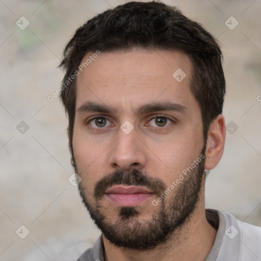 Neutral white young-adult male with short  black hair and brown eyes