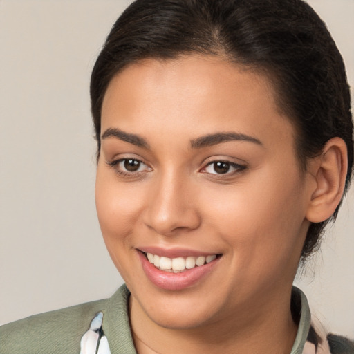 Joyful white young-adult female with long  brown hair and brown eyes