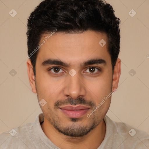 Joyful latino young-adult male with short  brown hair and brown eyes