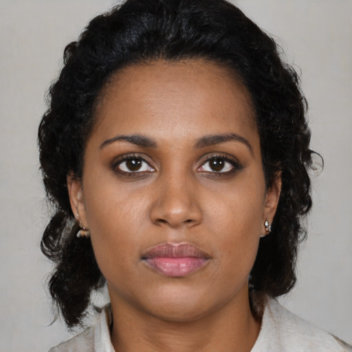 Neutral black young-adult female with medium  black hair and brown eyes