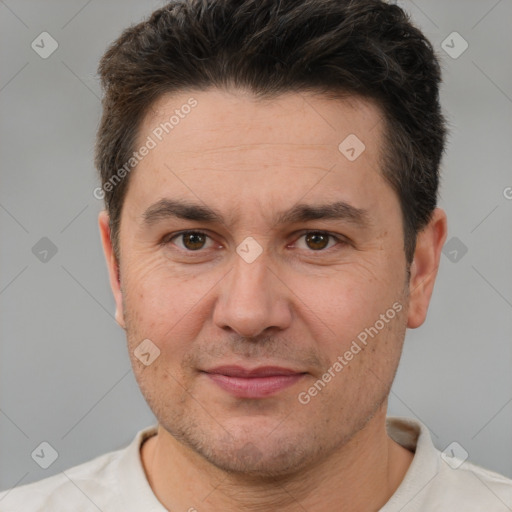 Joyful white adult male with short  brown hair and brown eyes