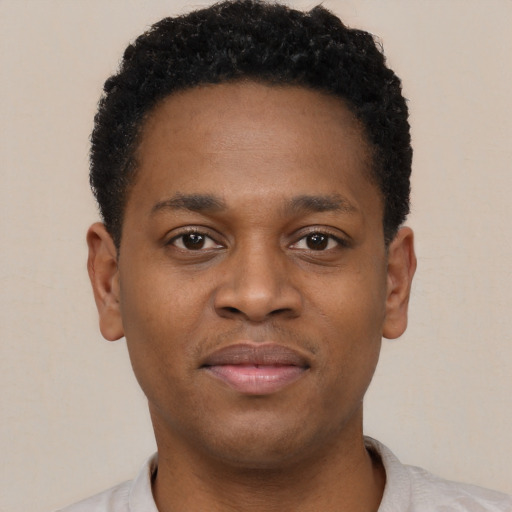 Neutral black young-adult male with short  black hair and brown eyes