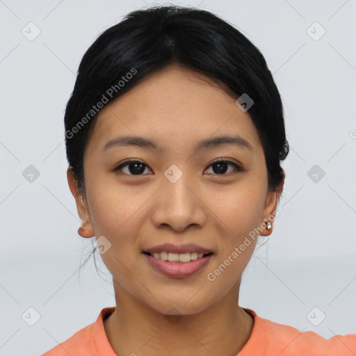 Joyful asian young-adult female with short  black hair and brown eyes