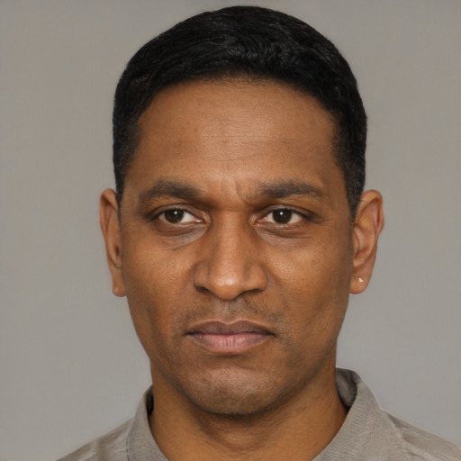 Neutral black adult male with short  black hair and brown eyes