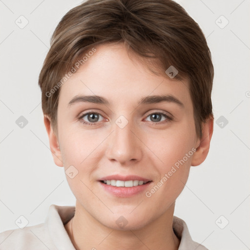 Joyful white young-adult female with short  brown hair and grey eyes