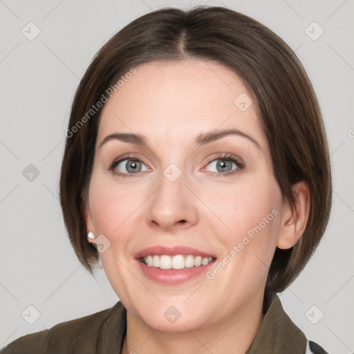 Joyful white young-adult female with medium  brown hair and grey eyes