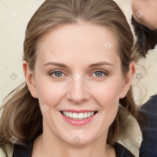 Joyful white young-adult female with medium  brown hair and blue eyes