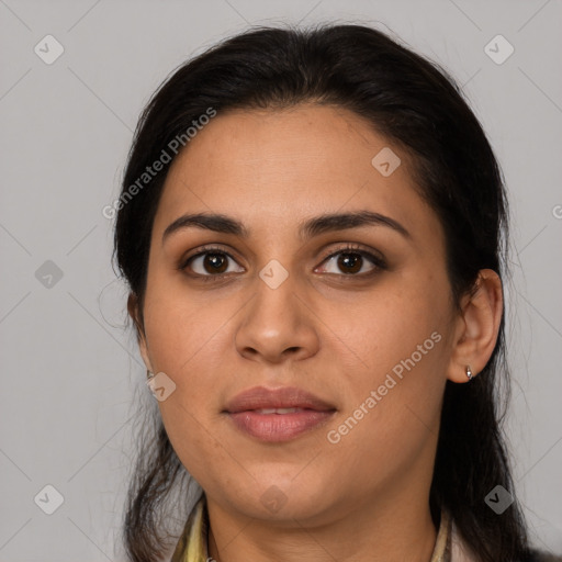 Joyful latino young-adult female with long  brown hair and brown eyes