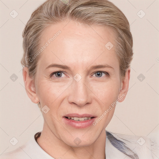 Joyful white adult female with short  brown hair and grey eyes