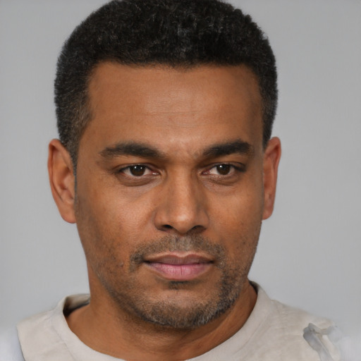 Neutral latino young-adult male with short  brown hair and brown eyes