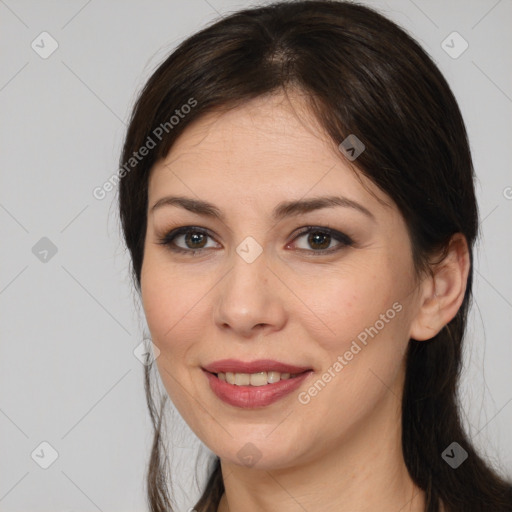 Joyful white young-adult female with medium  brown hair and brown eyes