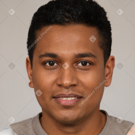 Joyful black young-adult male with short  brown hair and brown eyes