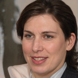 Joyful white adult female with medium  brown hair and brown eyes