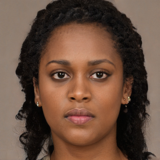 Neutral black young-adult female with long  black hair and brown eyes