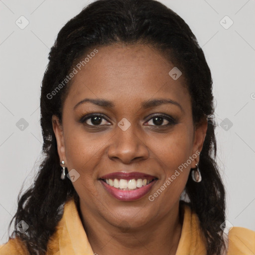 Joyful black young-adult female with long  brown hair and brown eyes