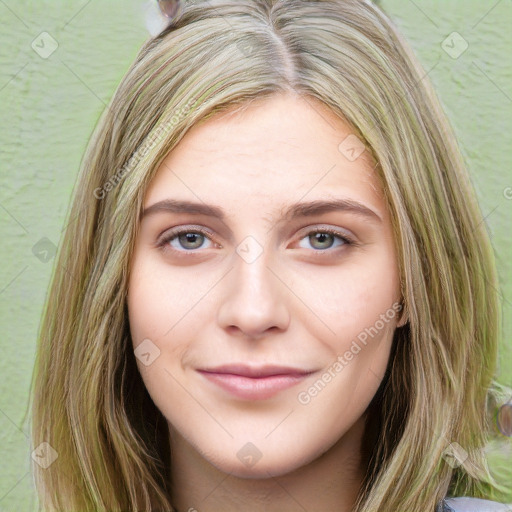 Joyful white young-adult female with long  brown hair and green eyes