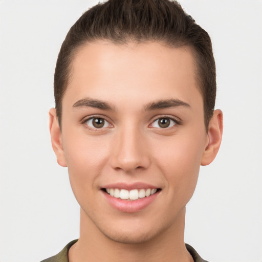 Joyful white young-adult male with short  brown hair and brown eyes