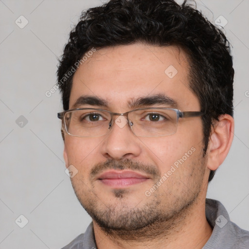 Joyful white young-adult male with short  black hair and brown eyes