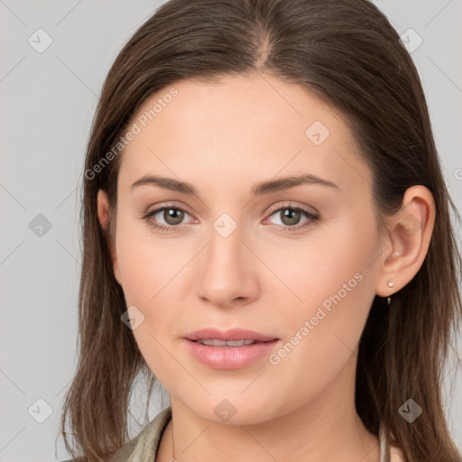 Joyful white young-adult female with long  brown hair and grey eyes