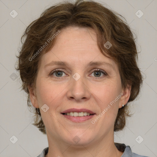 Joyful white adult female with medium  brown hair and grey eyes