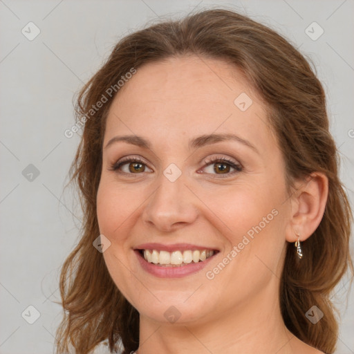 Joyful white young-adult female with long  brown hair and green eyes