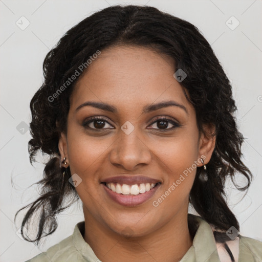 Joyful black young-adult female with long  brown hair and brown eyes