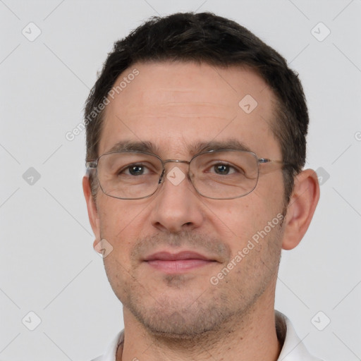 Joyful white adult male with short  brown hair and brown eyes