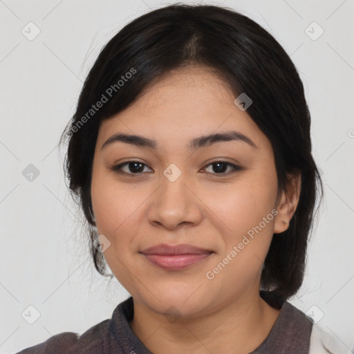 Joyful latino young-adult female with medium  black hair and brown eyes