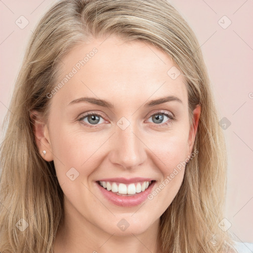 Joyful white young-adult female with long  brown hair and blue eyes