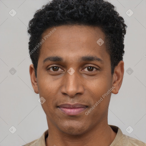 Joyful black young-adult male with short  black hair and brown eyes