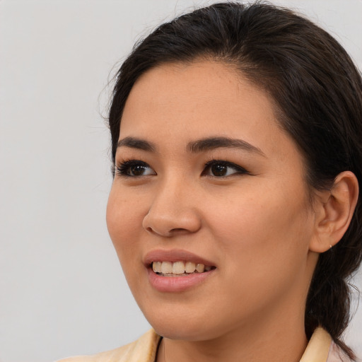 Joyful white young-adult female with medium  brown hair and brown eyes