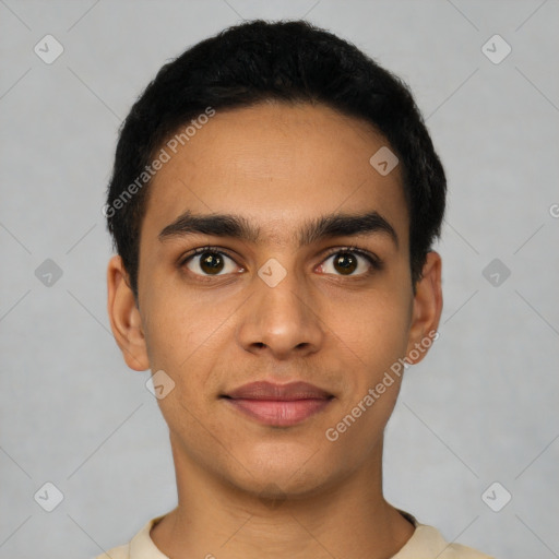 Joyful latino young-adult male with short  black hair and brown eyes