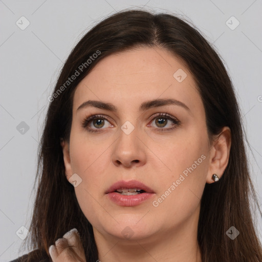 Neutral white young-adult female with long  brown hair and brown eyes