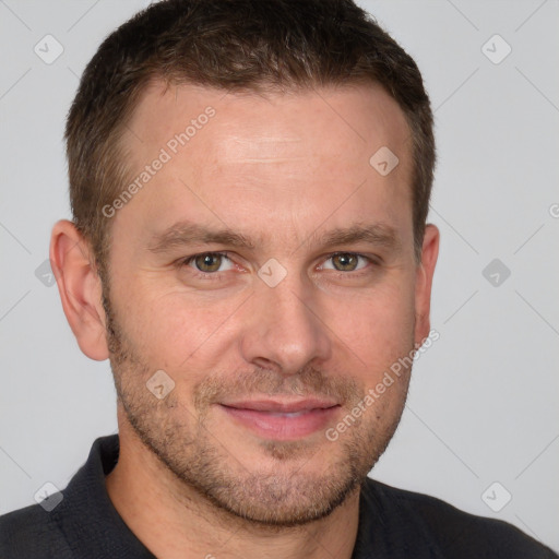 Joyful white adult male with short  brown hair and grey eyes