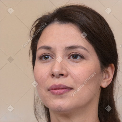 Joyful white adult female with medium  brown hair and brown eyes