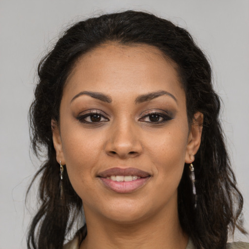 Joyful latino young-adult female with long  brown hair and brown eyes