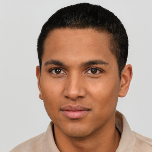 Joyful latino young-adult male with short  brown hair and brown eyes