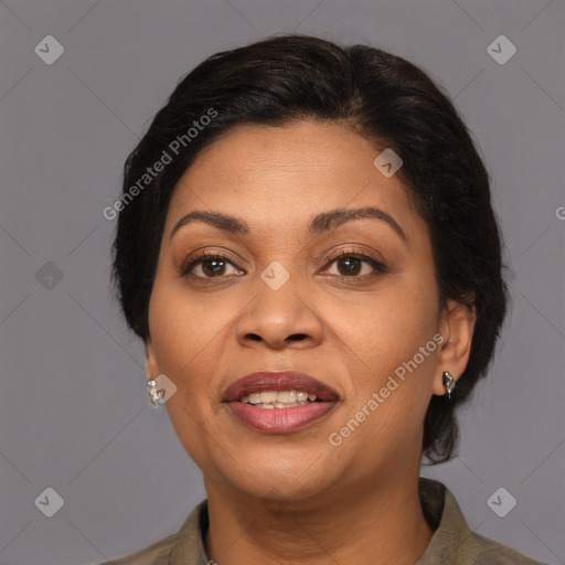 Joyful latino adult female with medium  brown hair and brown eyes