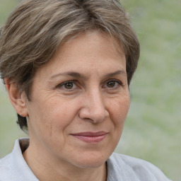 Joyful white adult female with short  brown hair and brown eyes