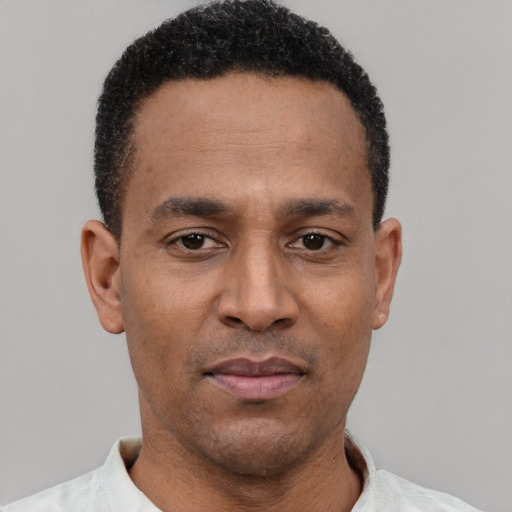 Neutral latino young-adult male with short  brown hair and brown eyes