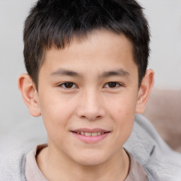 Joyful white child male with short  brown hair and brown eyes