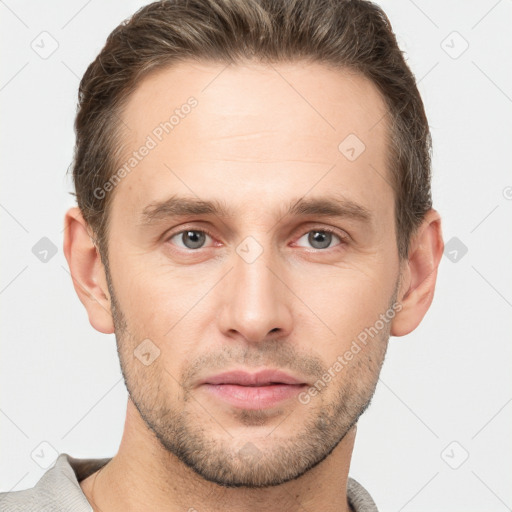 Joyful white young-adult male with short  brown hair and grey eyes