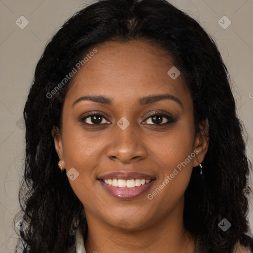 Joyful black young-adult female with long  brown hair and brown eyes