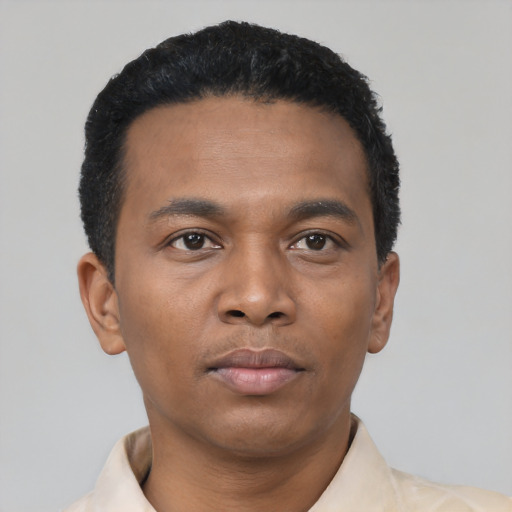 Neutral black young-adult male with short  black hair and brown eyes