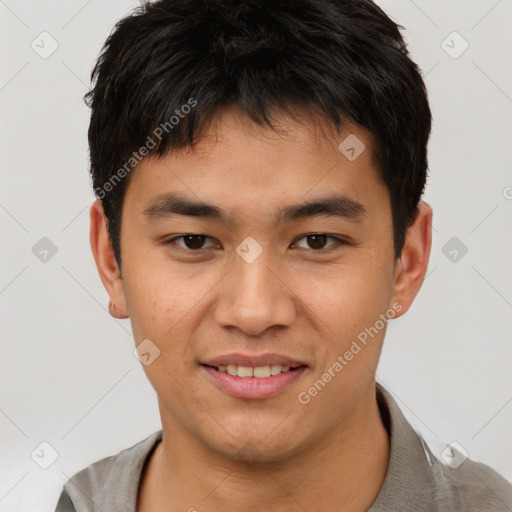 Joyful asian young-adult male with short  brown hair and brown eyes